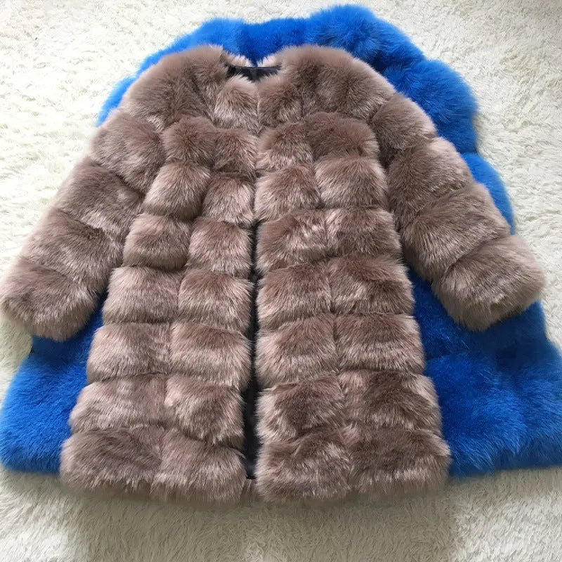 Women's long black faux fur coat with regular sleeves on a hanger.