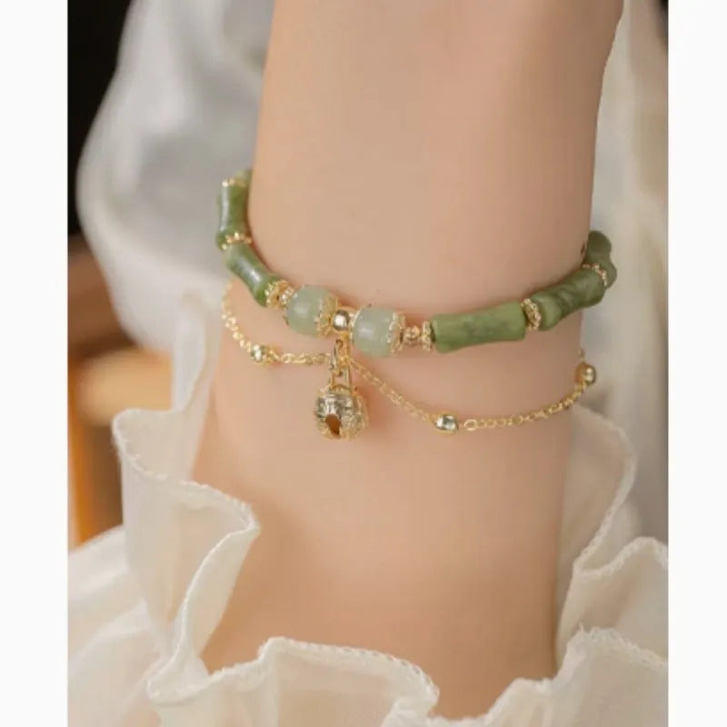 Women's natural Hetian jade bamboo bracelet on white background, adjustable 15+3 cm size