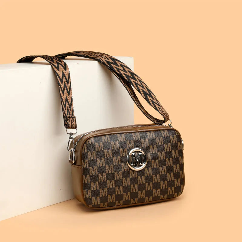 PU leather crossbody bag with wide adjustable strap and three-dimensional pocket in black colour