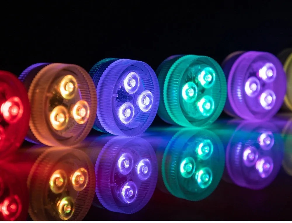 Compact white plastic remote control LED diving light for aquarium, shown with remote.