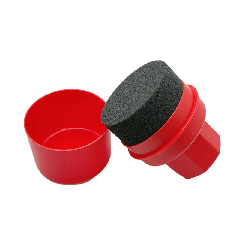 Black and red car tyre polishing sponge brushes with lids on a white background.