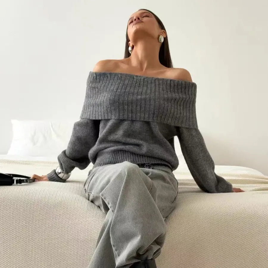 Grey strapless off-the-shoulder sweater with a 3D pattern on a mannequin.
