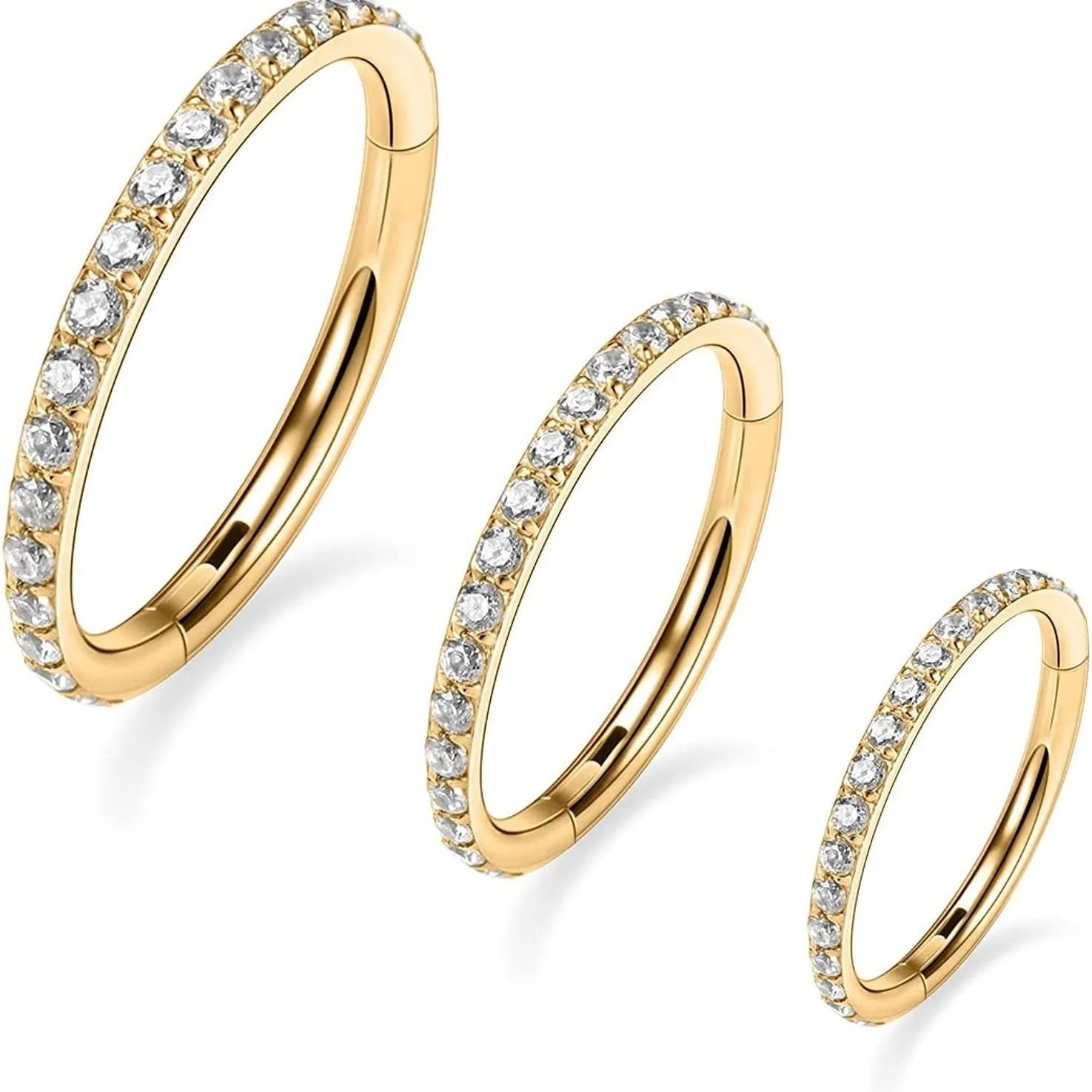 A round stainless steel seamless nose ring on a grey background, shown in a gold plated finish.