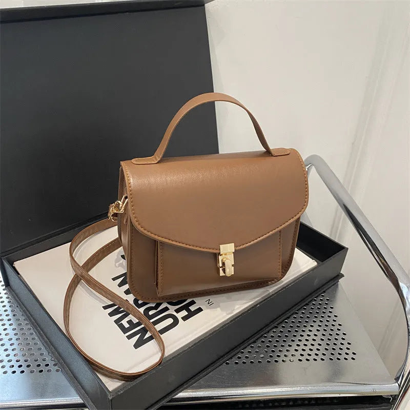 Retro-style horizontal square messenger bag in PU leather with crossbody strap and sandwich pocket