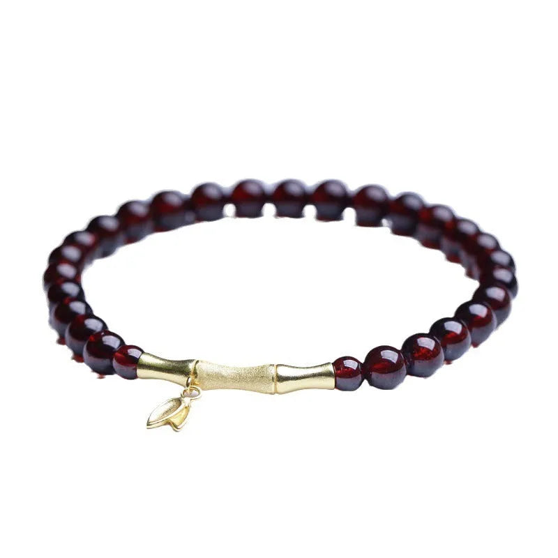Single ring bamboo joint bracelet with 6mm natural garnet bead in copper or silver finish