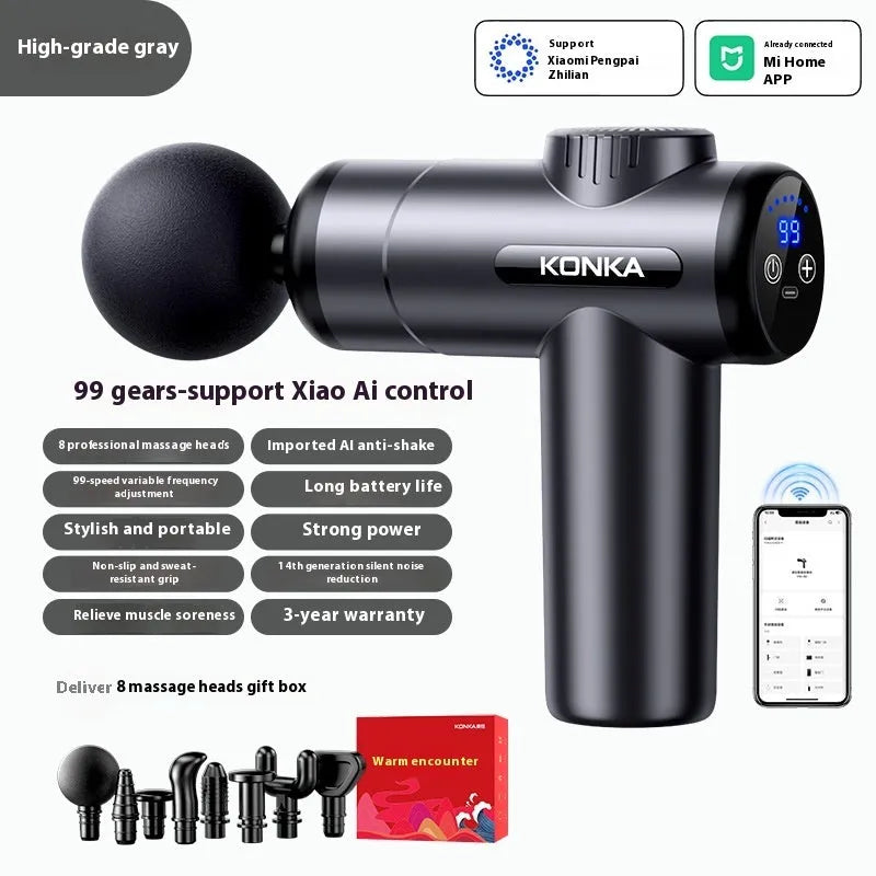 Konka brand mini massage gun with 8 massage heads in grey colour on a table
