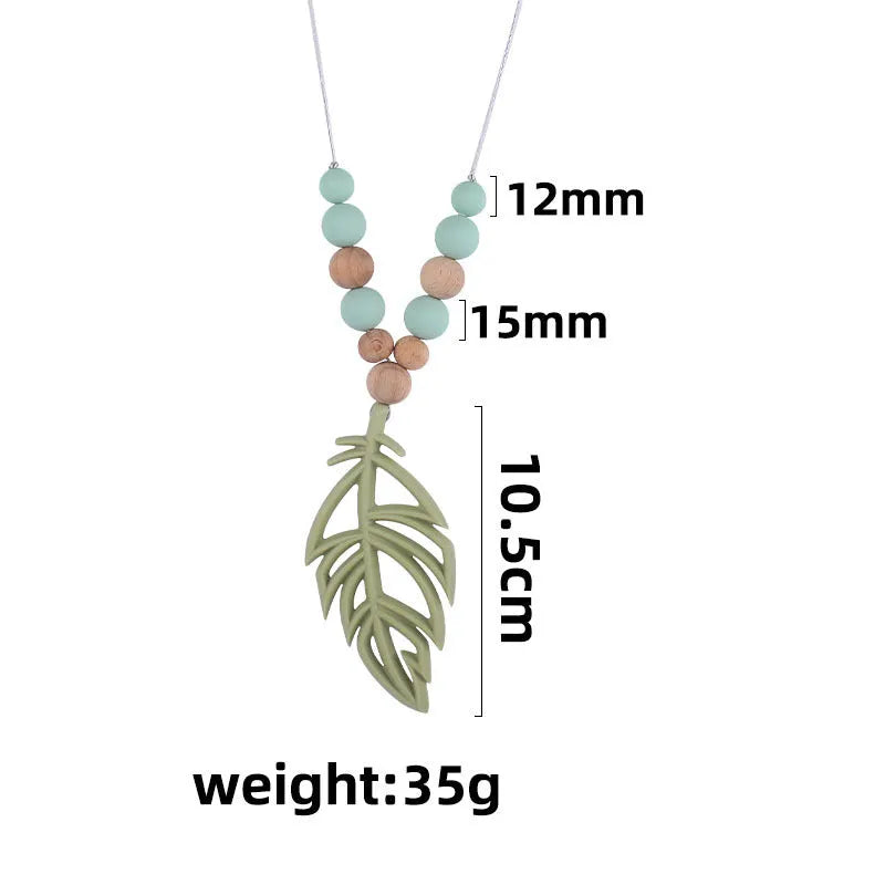 Silicone leaf teether necklace for babies over 3 months, about 35g, shown in mint green, bean green, pink, grey, turmeric, and blue