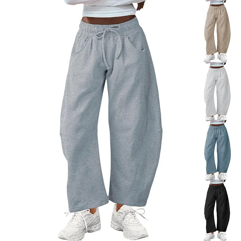 Women's loose cropped sweatpants in cotton fabric with elastic drawstring waistband in street fashion styling