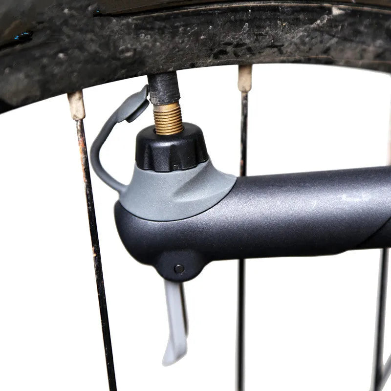 Black bicycle mini pump 18cm with round handle and aluminium alloy valve head on frame bracket
