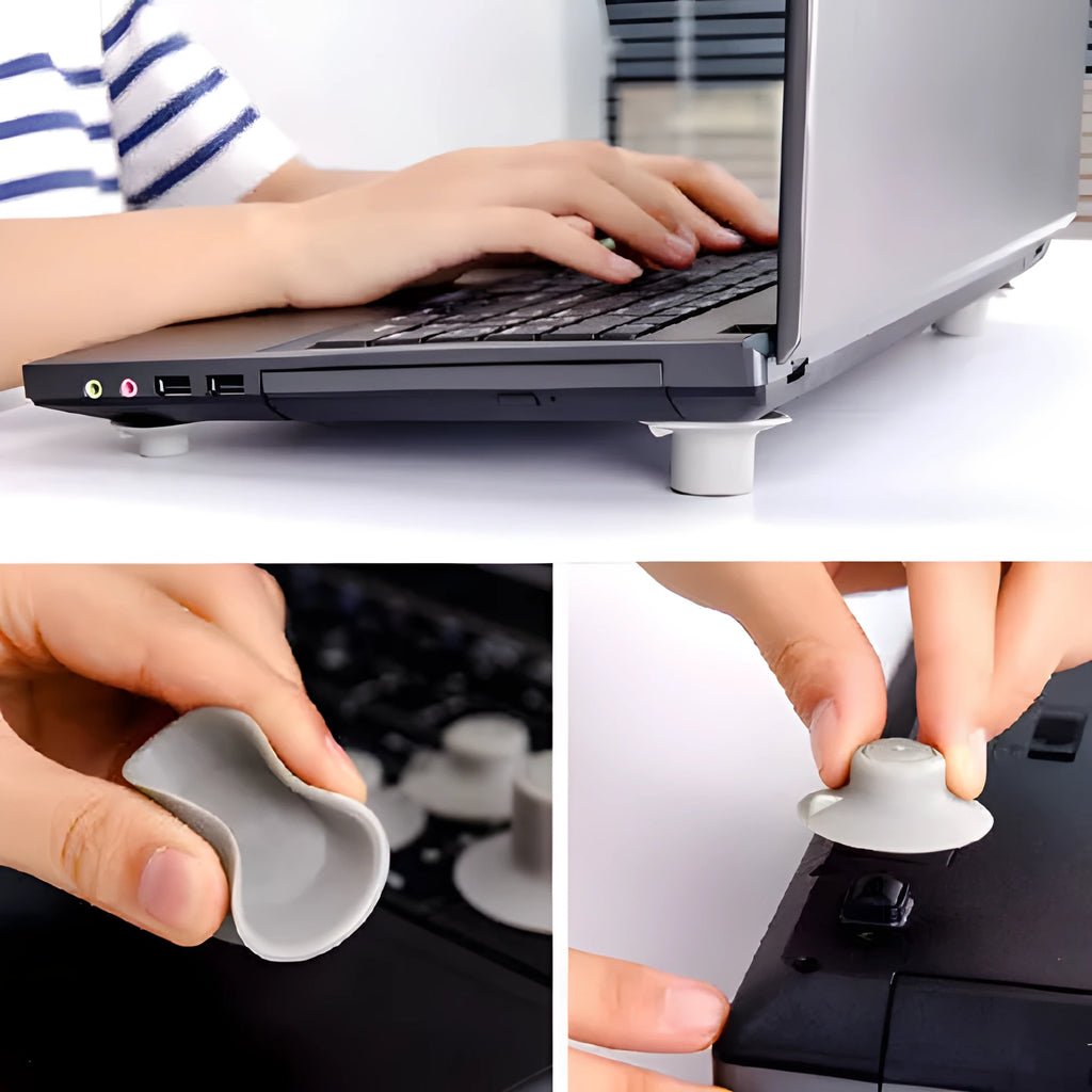 Grey plastic laptop cooling pad stand with four non-slip pads on a desk.