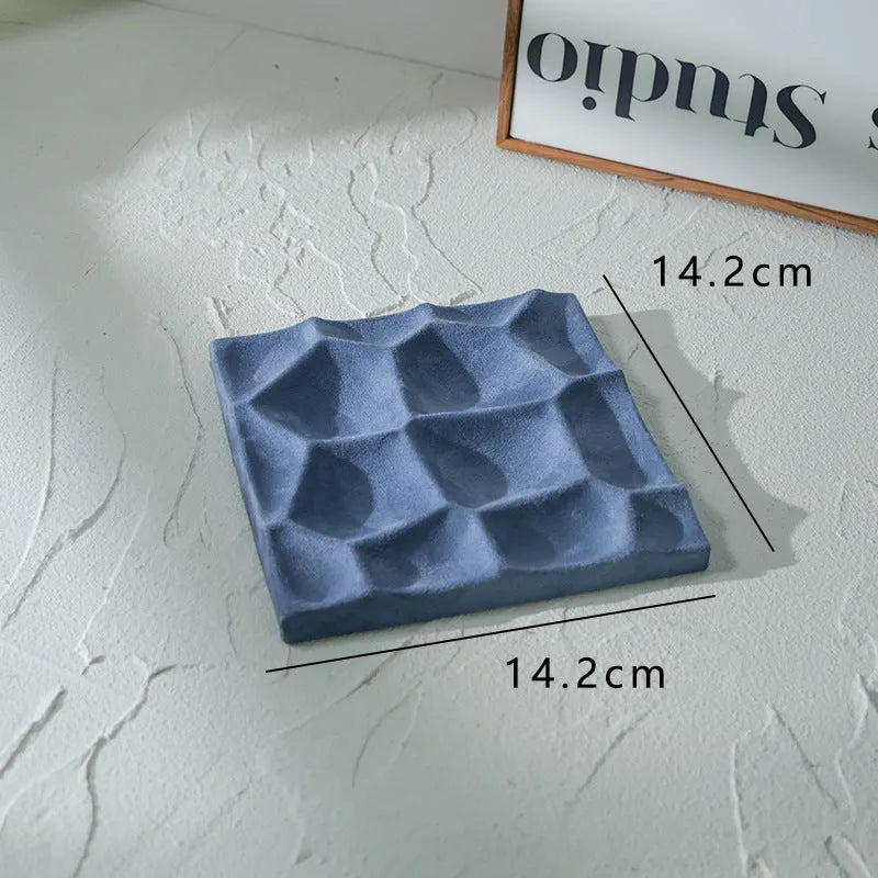 Flannel jewellery display stand in light blue with gypsum base showing 15cm round plate