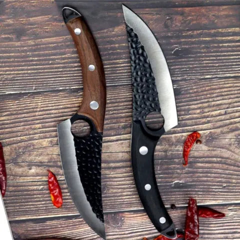 Slaughter and boning knife with curved blade, hammer pattern finish, ring handle, and brown leather sheath.