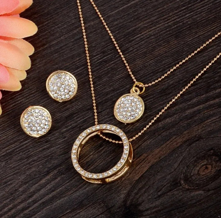 Gold-toned faux pearl necklace and earrings set for women with a central grey-turquoise bead