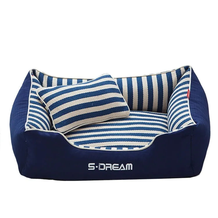 Navy stripes removable dog kennel mat and matching mini pillow set on a wooden floor