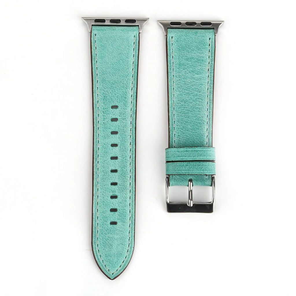 Genuine leather watch strap with a folding buckle in various colours on a grey background.