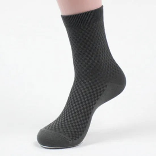 Pair of men's bamboo fibre business socks with small square pattern, shown in navy blue.