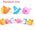 Plastic swimming turtle baby bath toy floating in water for aquatic play