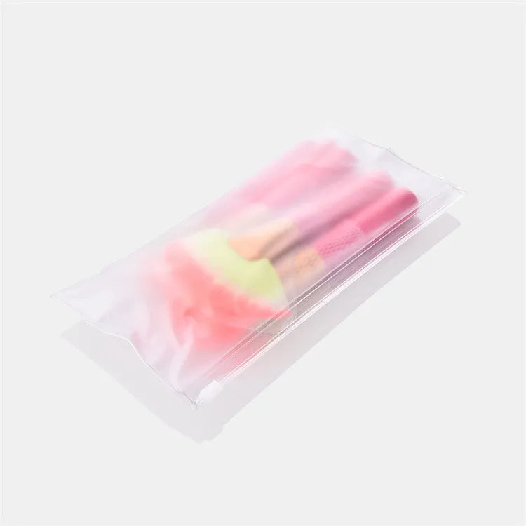Pink wooden handle synthetic bristle makeup brush set in a compact case