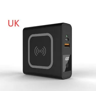 Super Qi wireless power bank in black with folding plug extended and four international adapter heads.
