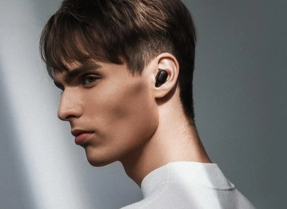 Redmi AirDots 2 black true wireless earbuds and charging case on a white background