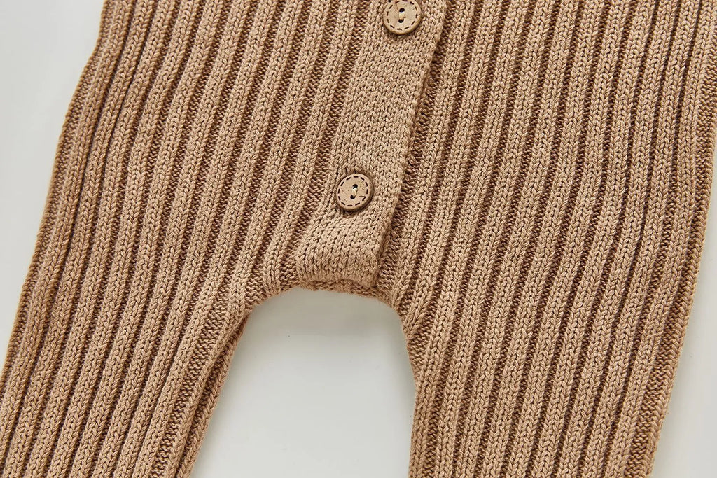 Baby long-sleeved knitted jumpsuit romper pullover in beige, size 80cm, lying flat on a white background