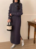 Acrylic knitted dress with half turtleneck, high waist, and midi length in solid colour
