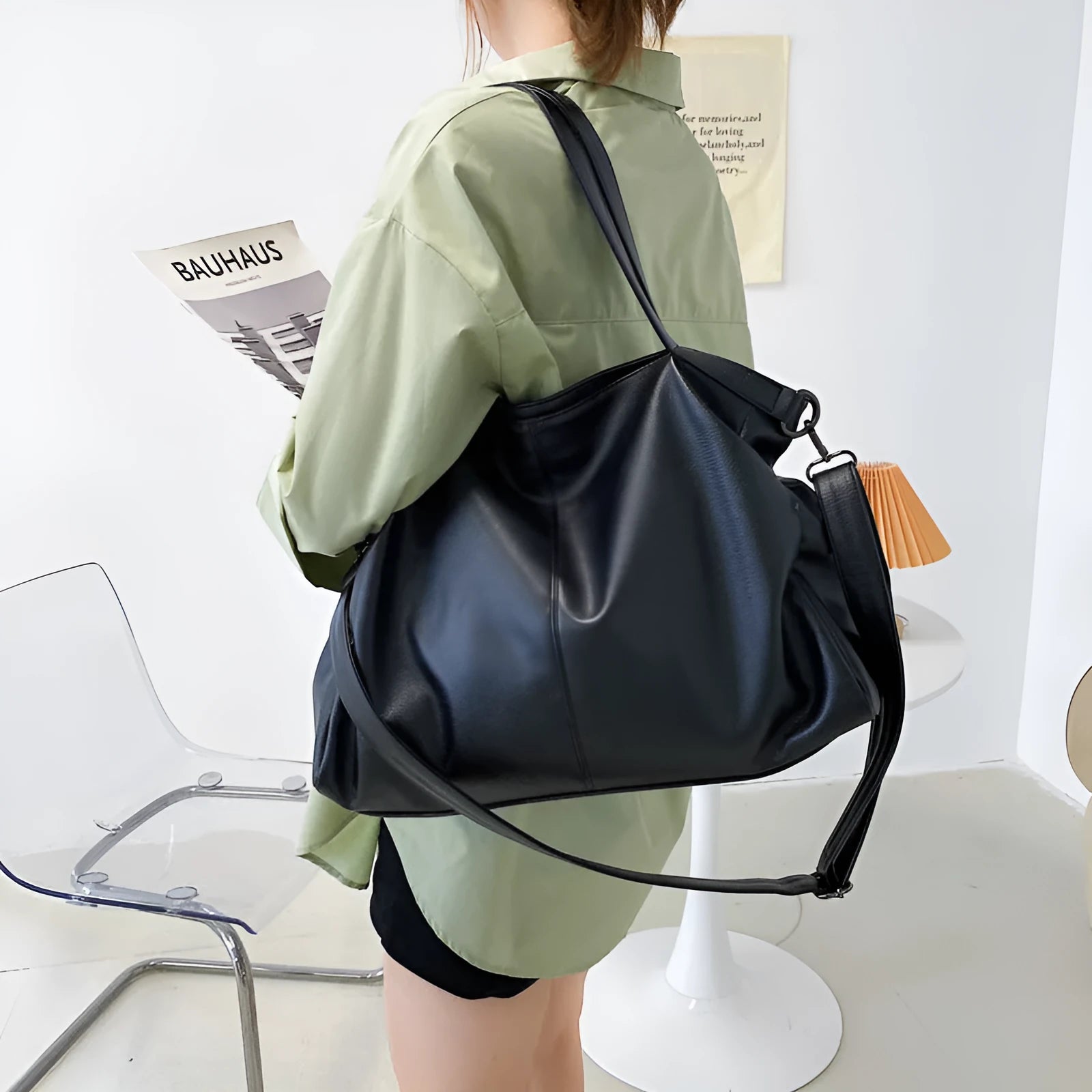 Soft surface PU leather messenger tote bag in a horizontal square shape with an adjustable shoulder strap.