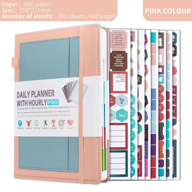 A5 notebook with PU leather cover in various colours, shown open to reveal blank pages and planning stickers.