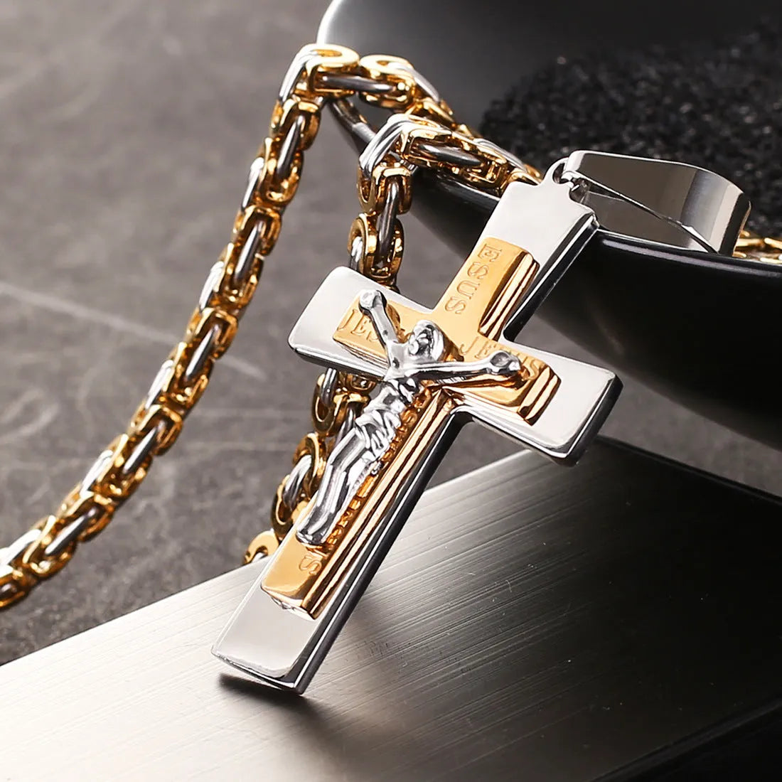 Titanium steel cross pendant necklace in gold finish on a clavicle chain