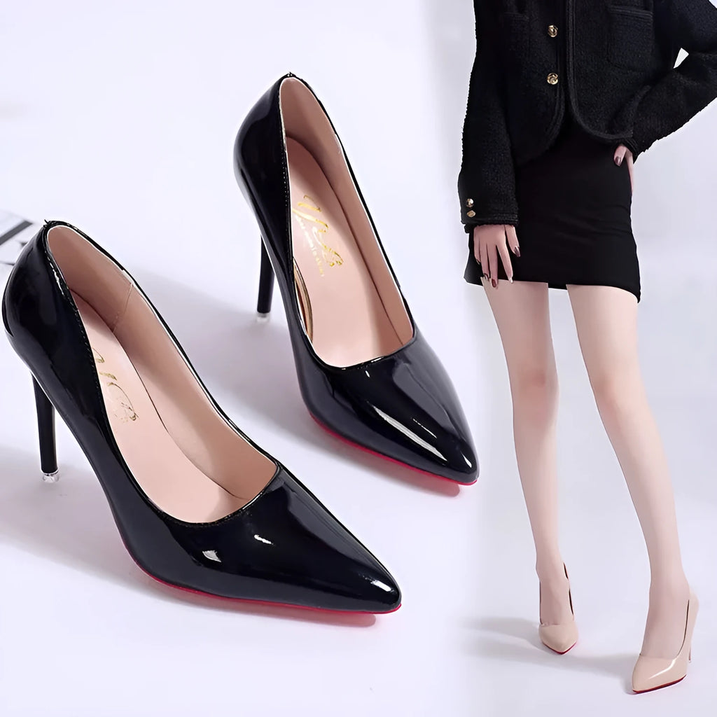Women's black stiletto heel pump with pointed toe and shallow cut on a white background.