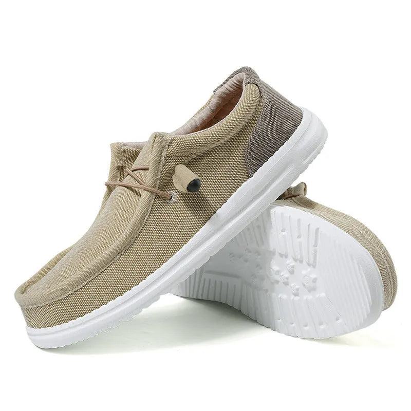 Men's green and orange canvas casual shoes with mosaic design and rubber sole.