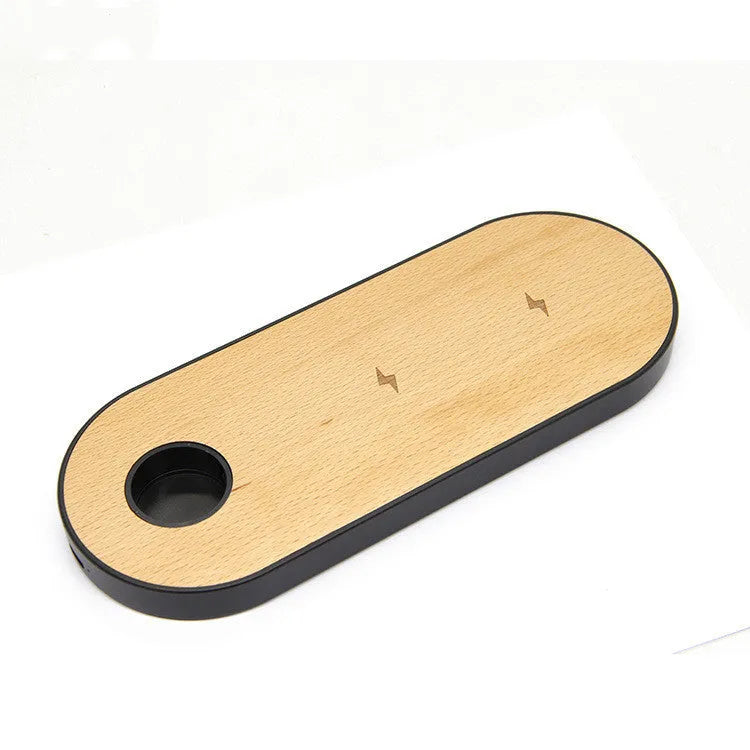 Natural bamboo wireless charging pad with wood accents on desk surface