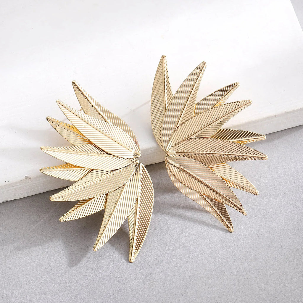Gold and white leaves patch alloy earrings with leaf design texture