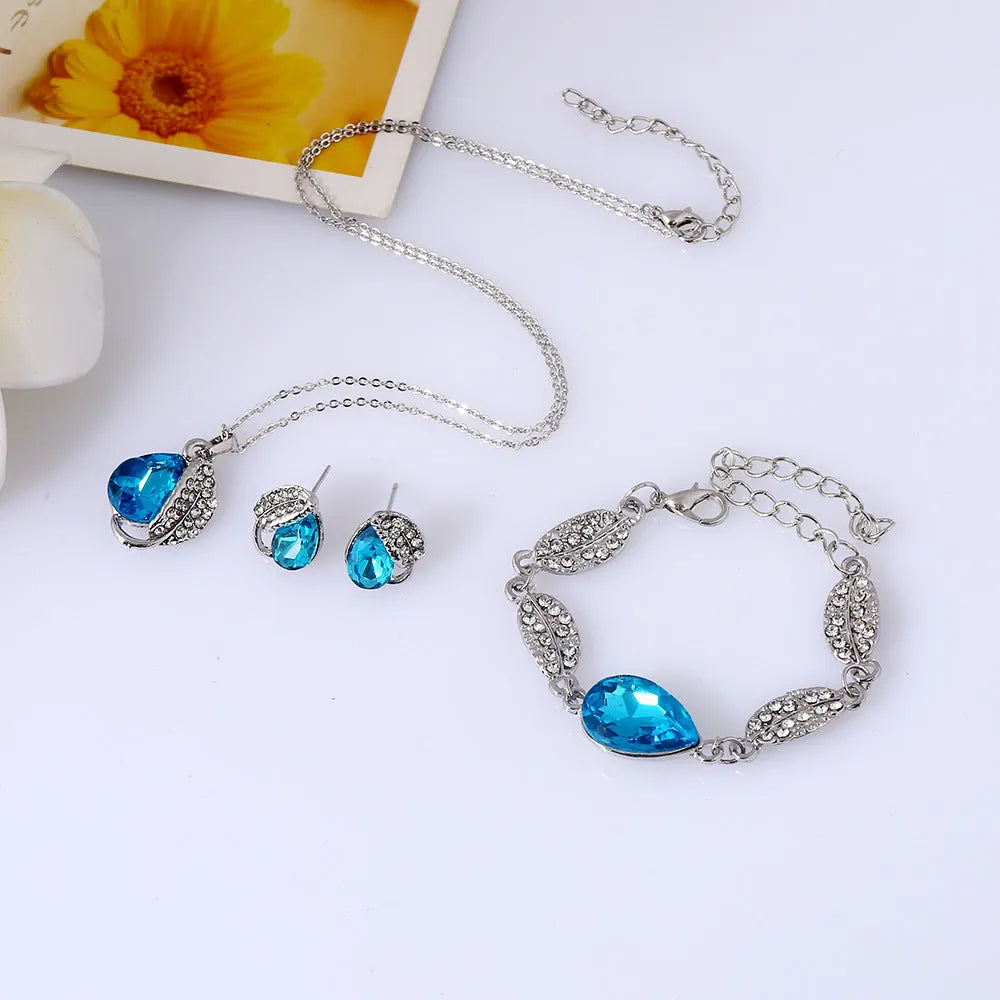 Three-piece bride headdress set with alloy bracelet, earrings, and pendant drop in European American cross-border design