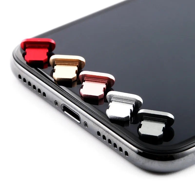 Aluminium alloy dust plug for iPhone charging port in various metallic colours.
