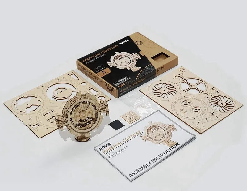 Wooden three-dimensional puzzle film projector with hand crank and gear wheel assembly