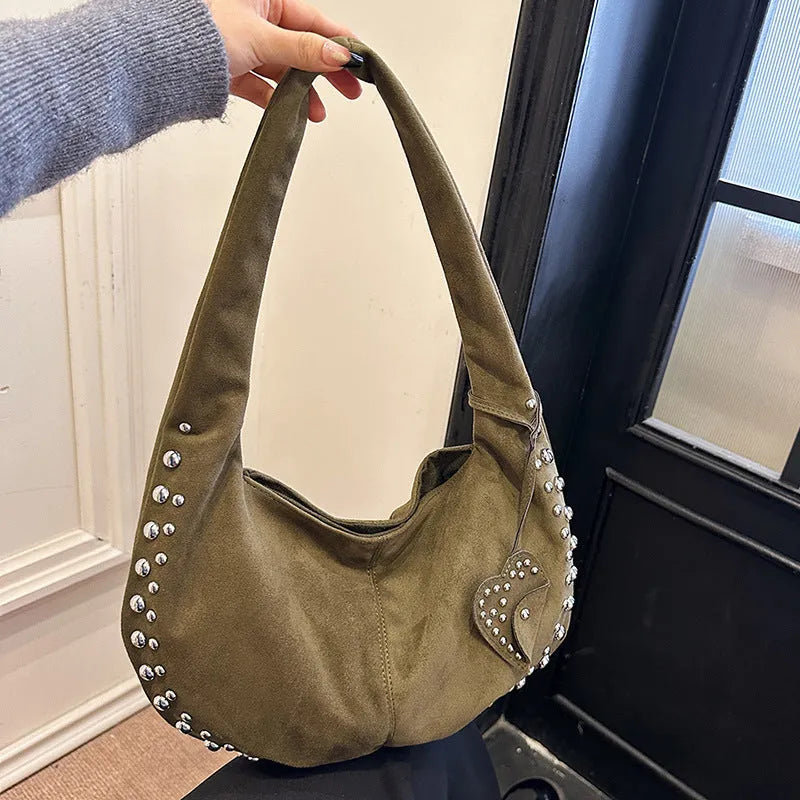 Soft plush retro tote handbag shown in black colour with strapless underarm carry design