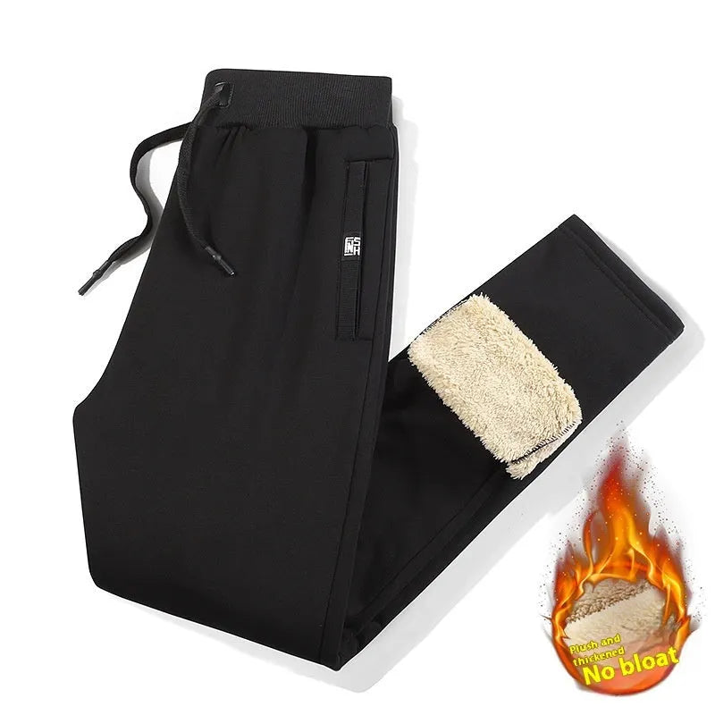 Men's grey fleece-lined cotton track pants with oversized fit and micro elastic waist.