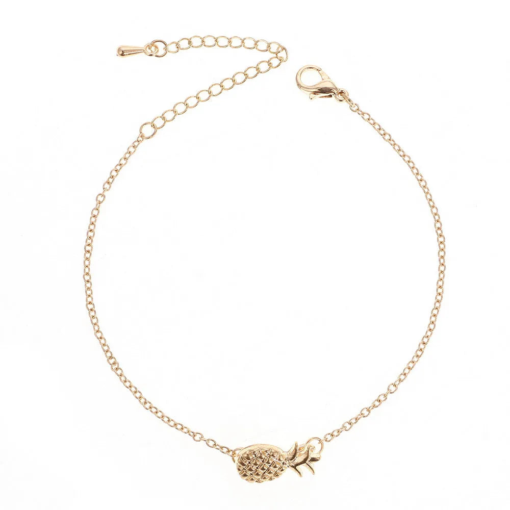 Gold tone and silver tone alloy pineapple bracelets for women on a white background.