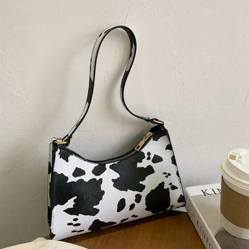 Women's small square leopard print underarm bag in soft PU with zip closure and single strap