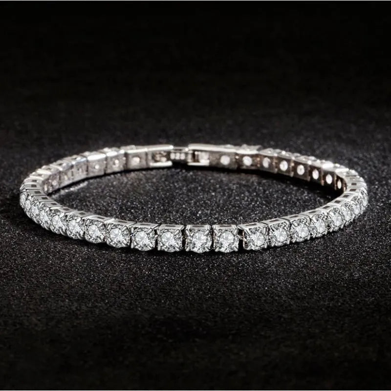 Women's simple diamond studded bracelet in gold finish with 4mm band width on white background