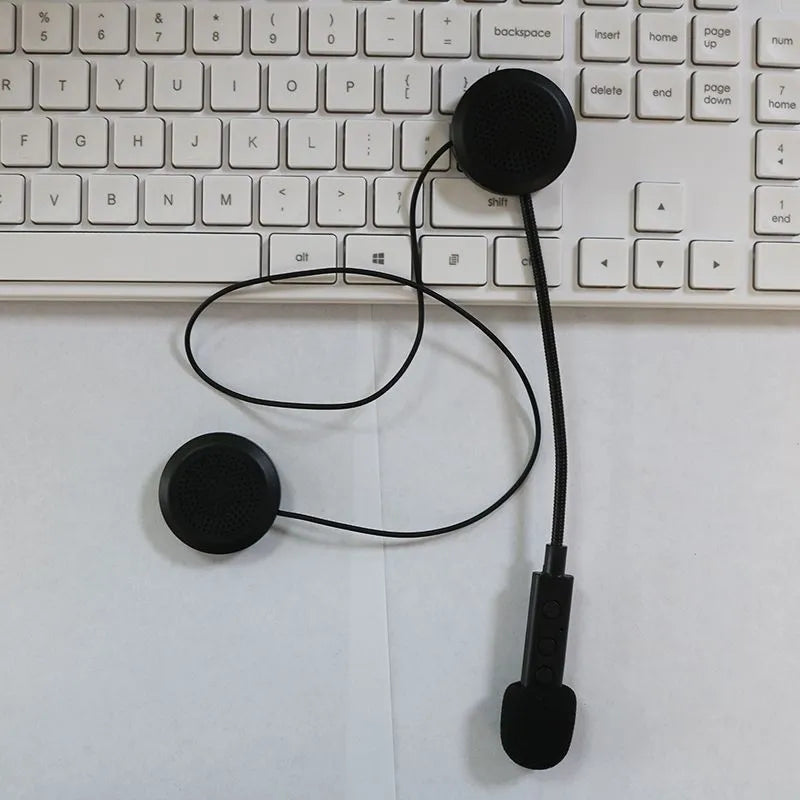 Black motorcycle helmet Bluetooth headset with large volume stereo and waterproof design on a dark background