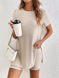 Women's black ribbed cotton shorts suit with crew neck top and matching shorts on a hanger.