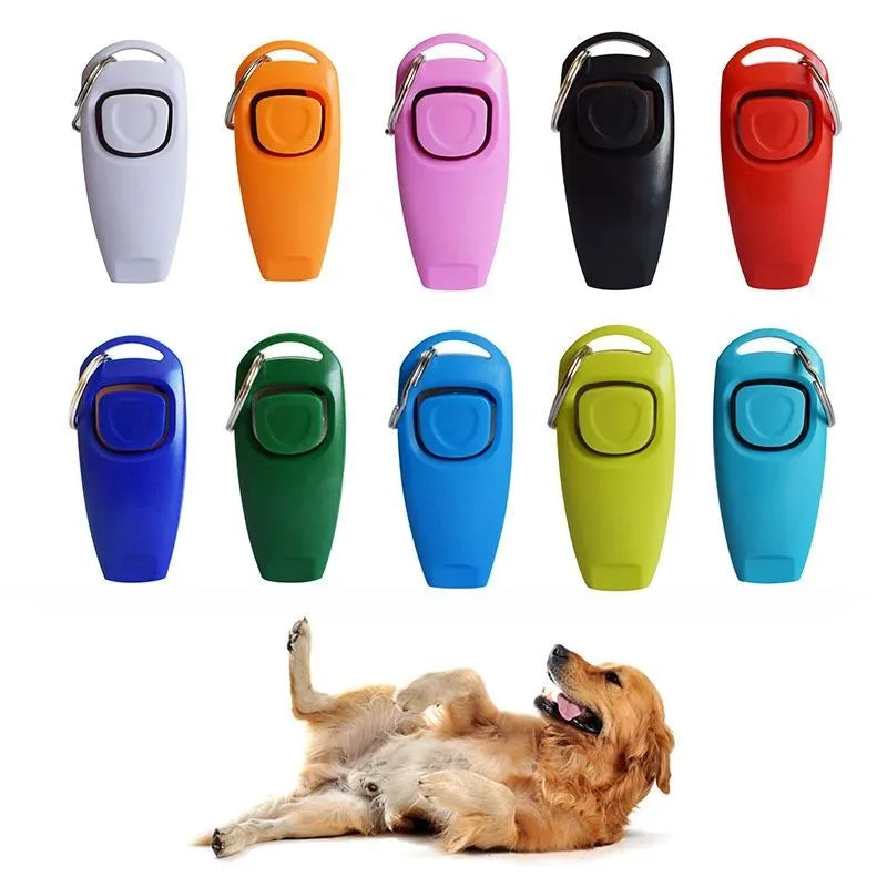 Pet training clicker and whistle set with key ring in orange, white, and blue plastic on a wooden table