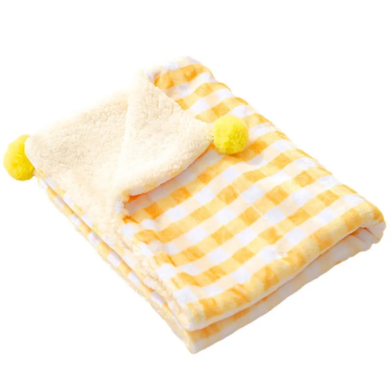 Blue coral fleece pet blanket shown in a large size on a wooden floor