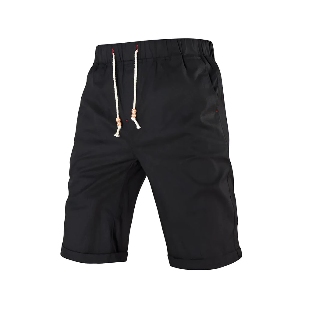 Men's solid colour cotton blend shorts with a drawstring waist and zipper pocket, shown in straight fit.