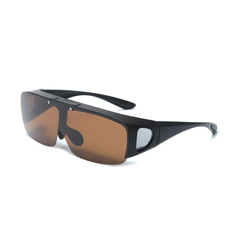 One-piece polarised sunglasses with myopia correction and multiple interchangeable coloured lens sheets laid out.