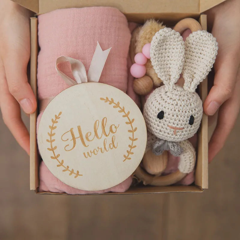 Set of six baby bath toys in peach, blue, and brown colours made from wood and chemical fibre