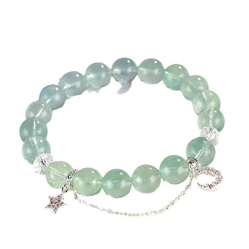 Green fluorite and white crystal star moon princess bracelet with electroplated setting and diamond-shaped stones.
