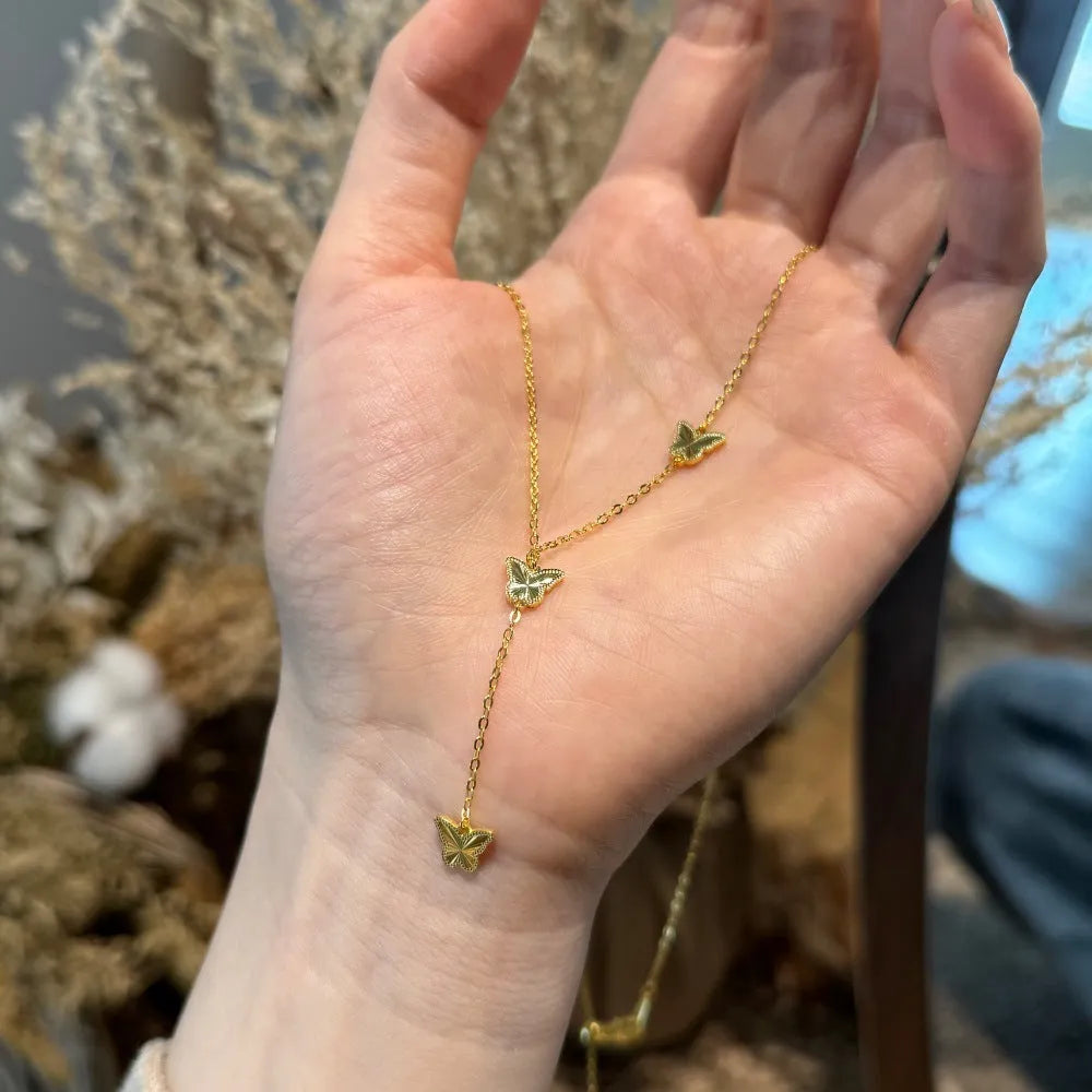 925 silver tassel butterfly pendant clavicle chain in electroplated 14K gold colour on display
